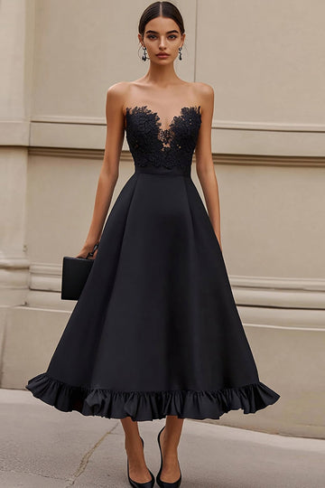 Robe longue formelle noire sans bretelles à volants